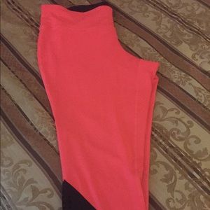 Fluorescent pink and black capri leggings